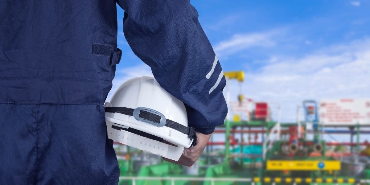 engineer-hand-holding-white-safety-helmet-with-blu-2026-03-24-17-02-04-utc